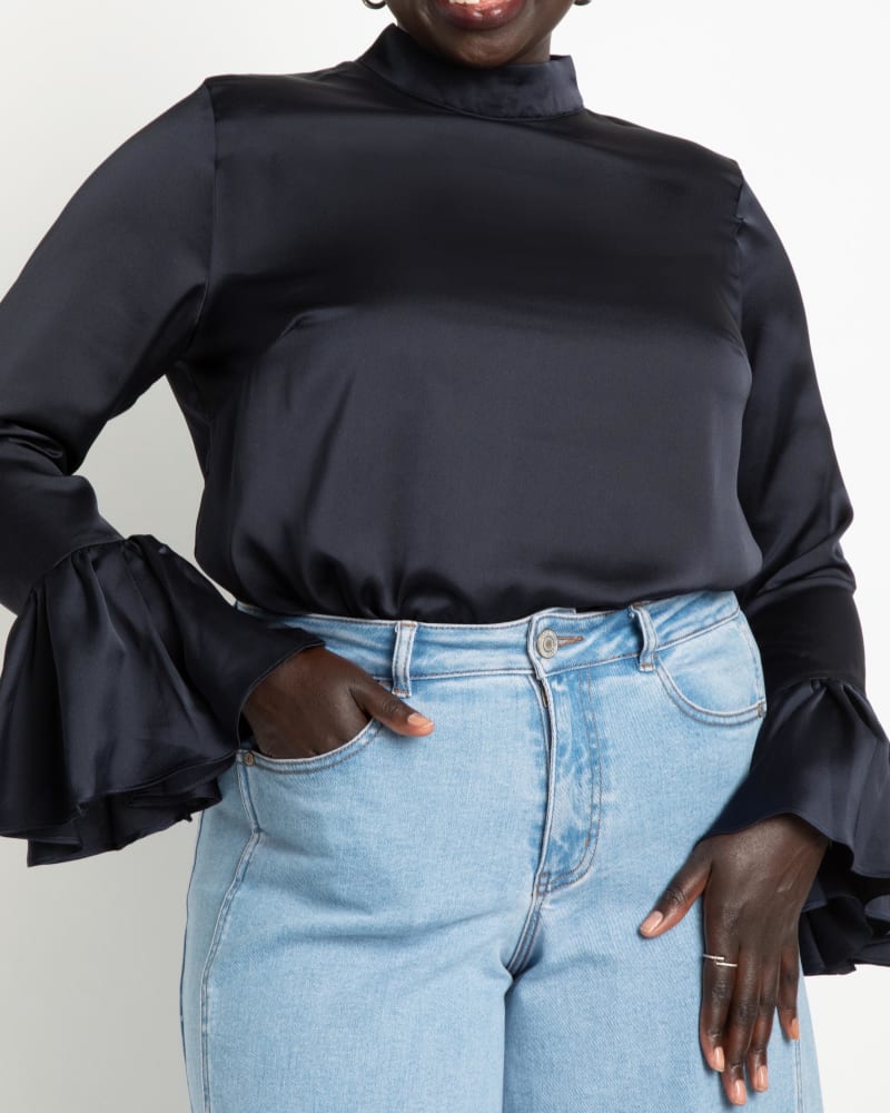 Front of a model wearing a size 14 Lorena Satin Blouse in Beacon Blue by ELOQUII. | dia_product_style_image_id:236667